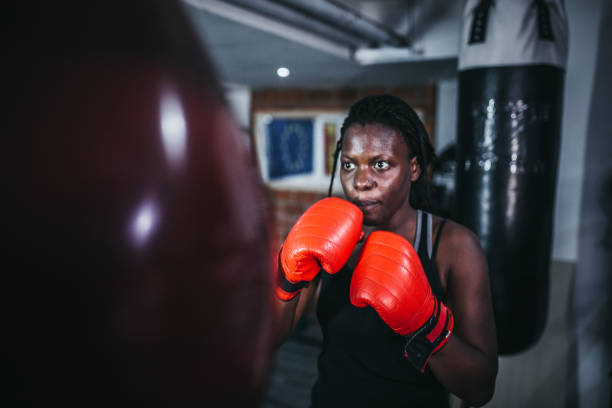 istock Woman boxing at the gym 1270326756