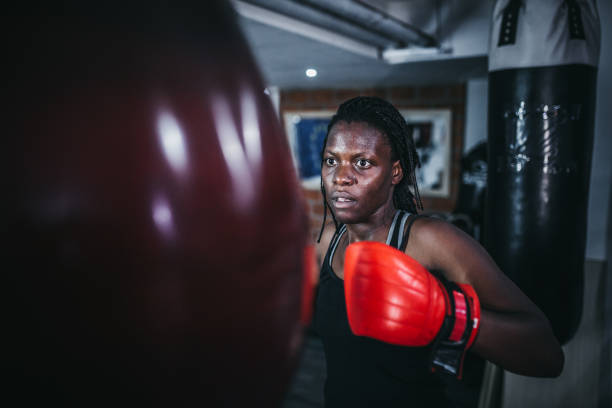 istock Woman boxing at the gym 1270326905