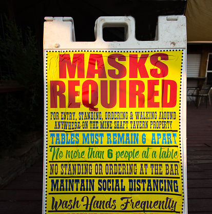 Madrid, NM: A “Masks Required” sign outside a restaurant in Madrid, NM, a former ghost town that is now a tourist destination 28 miles south of Santa Fe.
