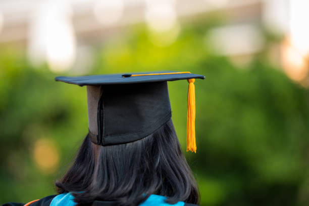 istock Back view of a female graduate with a university degree 1270333549