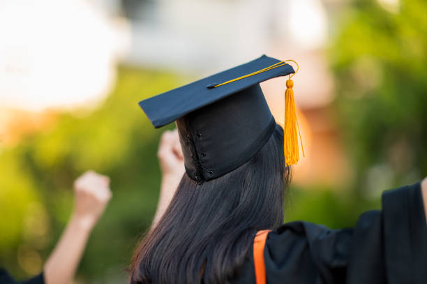 istock Back view of a female graduate with a university degree 1270333551