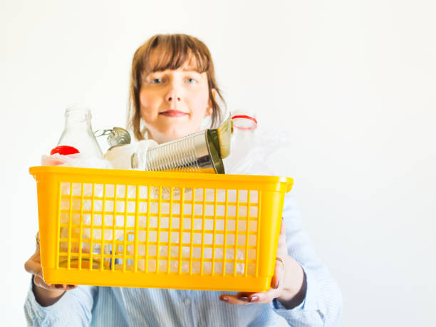 istock Caucasian woman with trash ready for recycling 1270334226