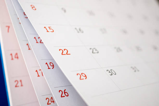 istock Calendar page flipping sheet close up on office table background business schedule planning appointment meeting concept 1270334556