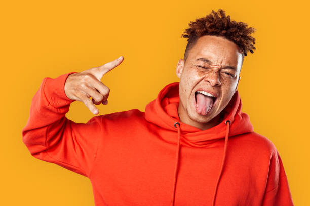 istock Young adult guy showing rock n roll gesture 1270334562