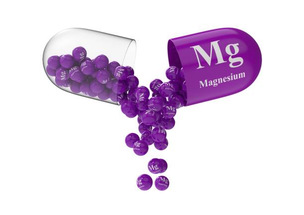 istock Open capsule with magnesium from which the vitamin composition is pouring 1270335880