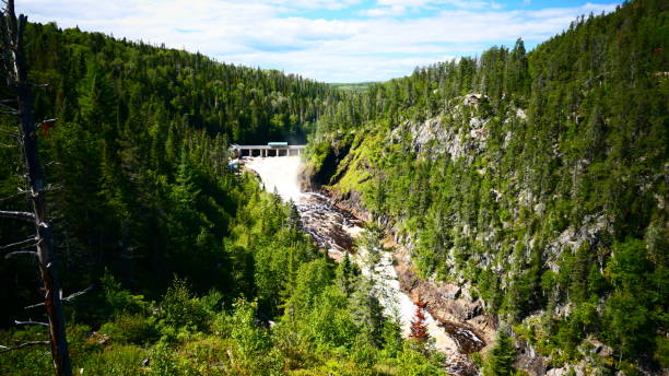 istock Dam spilling into a canyon seen high 1270335934