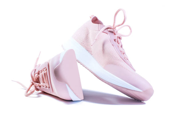 Pink sport shoes isolated on white background