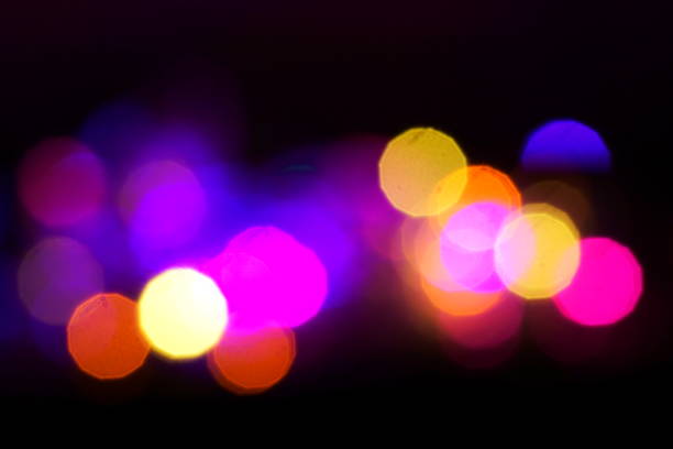 Natural lighting lamp rays bokeh effect. Multicolored light leaks on black background. Lens studio flare leak burst overlays.