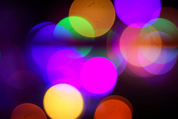 Natural lighting lamp rays bokeh effect. Multicolored light leaks on black background. Lens studio flare leak burst overlays.