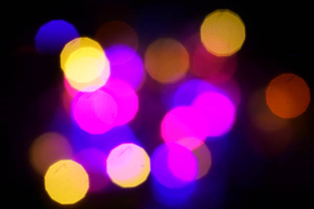 istock Natural lighting lamp rays bokeh effect. Multicolored light leaks on black background. Lens studio flare leak burst overlays. 1270348499