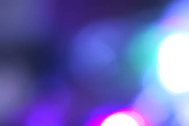 istock Natural lighting lamp rays bokeh effect. Multicolored light leaks on black background. Lens studio flare leak burst overlays. 1270350735