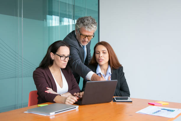 istock Group of top managers watching and discussing presentation 1270352204