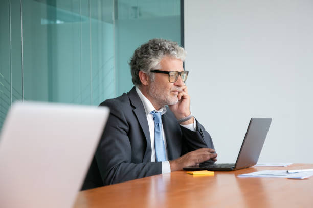 istock Serious mature professional in suit and glasses 1270353660