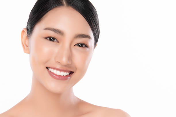 istock Beautiful smile young woman. White teeth on the master plan. Free space and white background, 1270353690