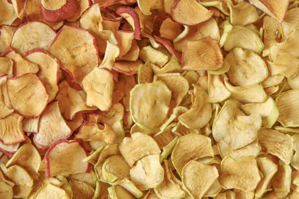 sliced and dried apples. - dried apple imagens e fotografias de stock