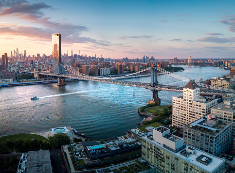 Aerial panorama of Manhattan bridge and the East river at sunset