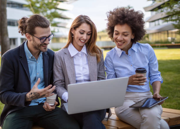 istock Young business people using s a computer outdoors 1270358680