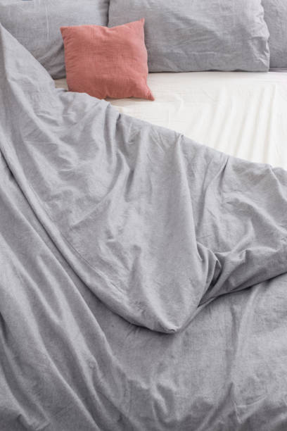 istock bed with gray and pink  linens top view 1270362091