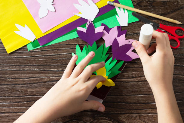 istock Step 13 instruction. Greeting card for mother's day with spring flowers crocuses. Handmade Paper Craft Ideas. The project of children's creativity, crafts, crafts for children. 1270364167