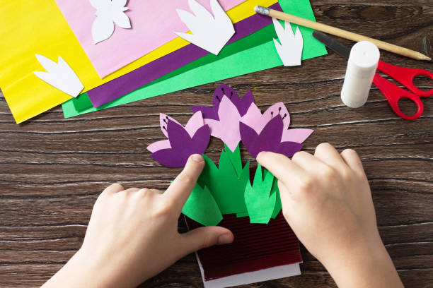 istock Step 12 instruction. Greeting card for mother's day with spring flowers crocuses. Handmade Paper Craft Ideas. The project of children's creativity, crafts, crafts for children. 1270364177