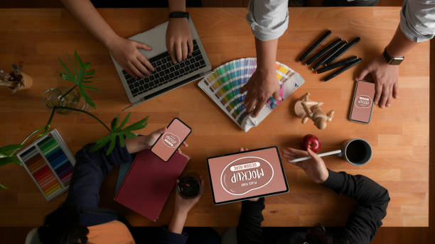 istock Designer team brainstorming on their project with mock up digital devices and designer supplies 1270364478