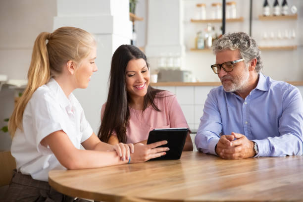 istock Female agent or manager meeting with couple 1270365449