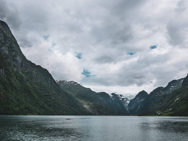 istock Dark clouds over a fjord in Norway 1270367433