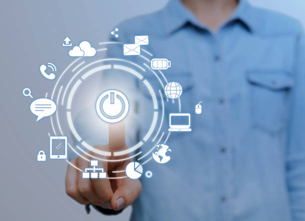 istock IoT. Woman pressing start button on digital screen with communication network icons 1270372224