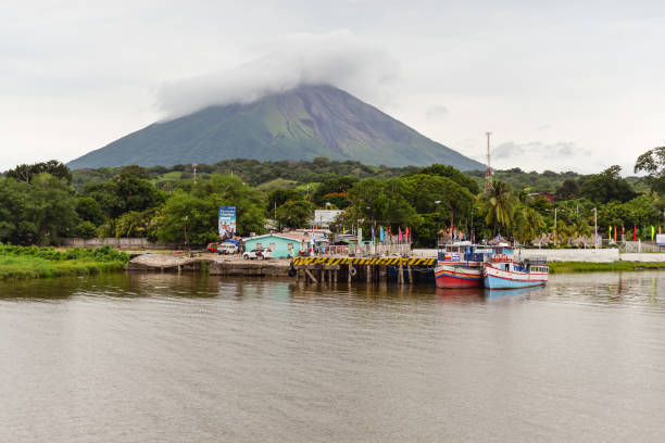 Ometepe Island / Nicaragua - July 15, 2019: Arrival port with welcome sign on Isla Ometepe with volcano in the background
