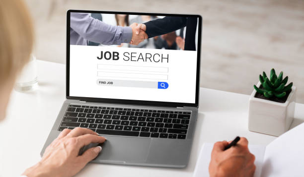 istock Lady using laptop with job search engine on screen 1270372985