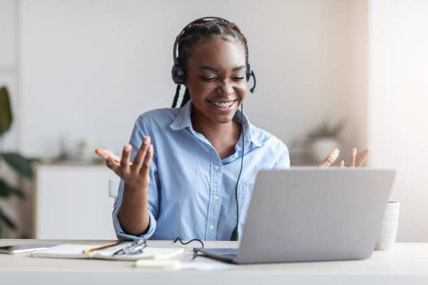 istock Video Conference. Friendly black woman having web call on laptop at office 1270373550