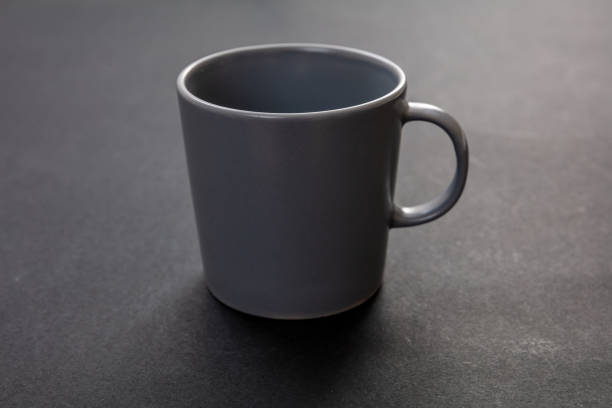 istock Coffee mug grey color on black background. Hot beverage cup mockup template 1270374187
