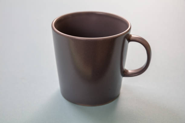 istock Coffee mug grey color on pastel blue background. Hot beverage cup mockup template 1270374194