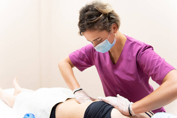 istock Physiotherapist treating a patient during pandemic 1270379661