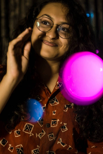 istock woman between fairy lights 1270379768