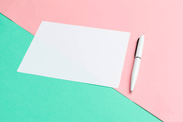istock White paper notepad on pastel color background.Flat lay design. creative photo 1270382115