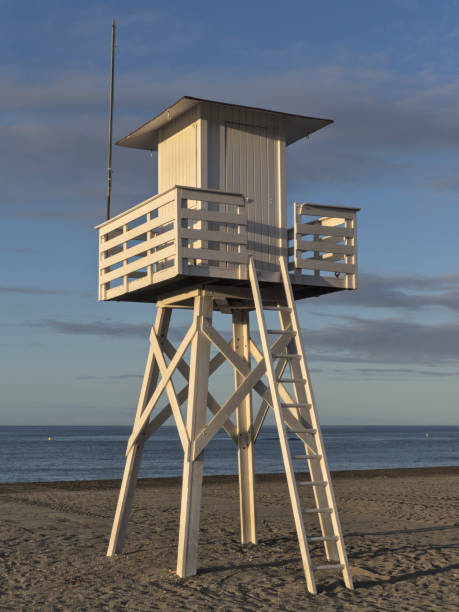istock Lifeguard tower beach at sunrise with nobody 1270382315