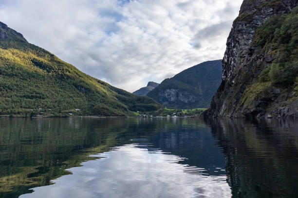 istock View from water of fjord on coast with bright reflection 1270382408