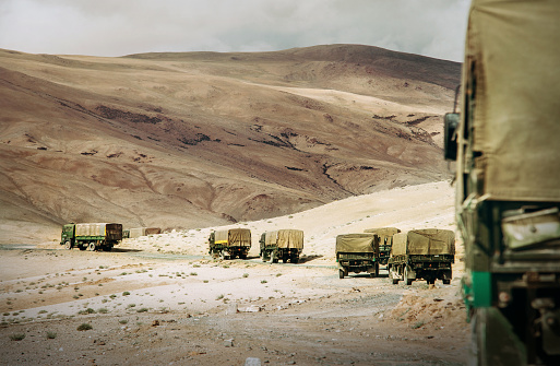 Ladakh region. Military Truck Convoy on the high mountain Leh - Manali highway on Jammu and Kashmir, Nothern India