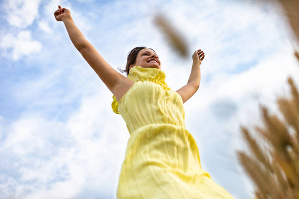 istock Happy woman in wheat field 1270386744