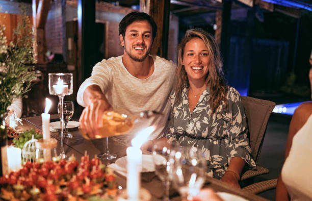 istock Group of friends having dinner party 1270386903
