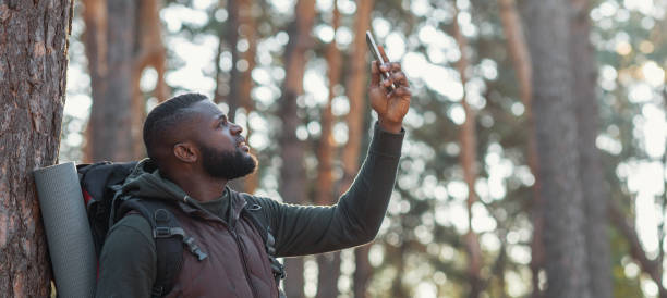 istock African man hiker looking for mobile network in forest 1270389173