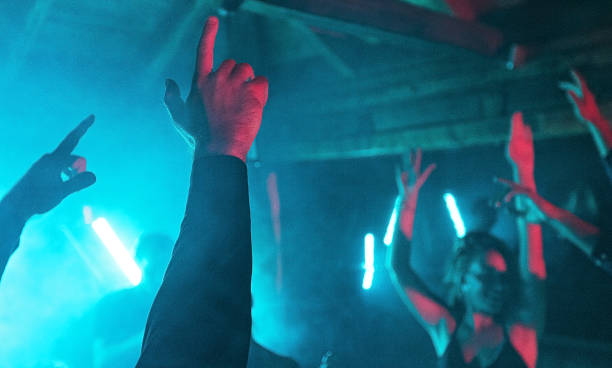 istock Hands raised up in night club 1270389662
