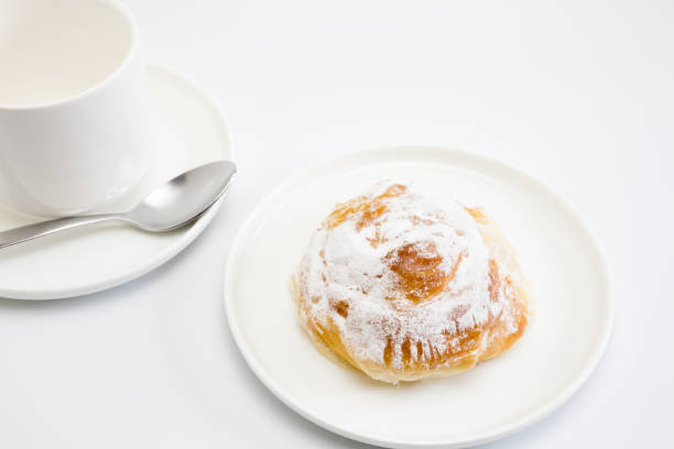 istock Breakfast with ensaimada cake typical of the Balearic Islands 1270391239