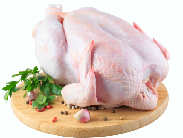 istock raw chicken carcass on the cutting board isolated on white background. 1270392670