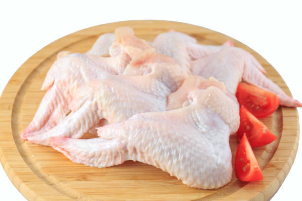 raw chicken wings on the white background