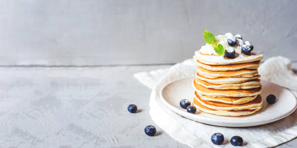 istock Stack of pancakes with fresh blueberry. 1270392695
