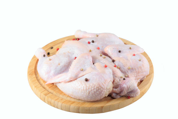 istock raw chicken carcass on the cutting board isolated on white background. 1270392750