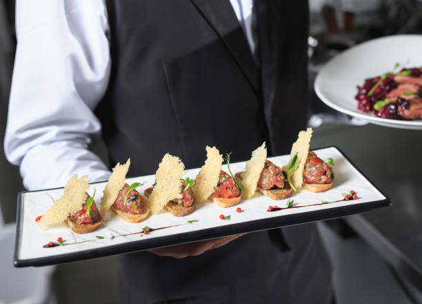 istock The waiter with the ready prepared dishes in the restaurant kitchen. 1270393865