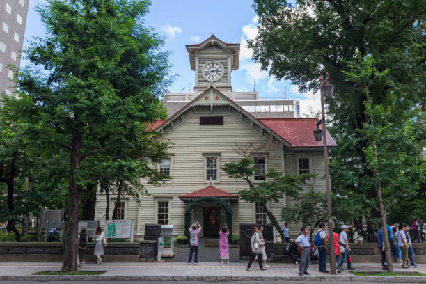 People at Sapporo Clock Tower. It is located in Chuo-ku, Sapporo, Hokkaido, Japan. It is a well-known tourist attraction in Sapporo.